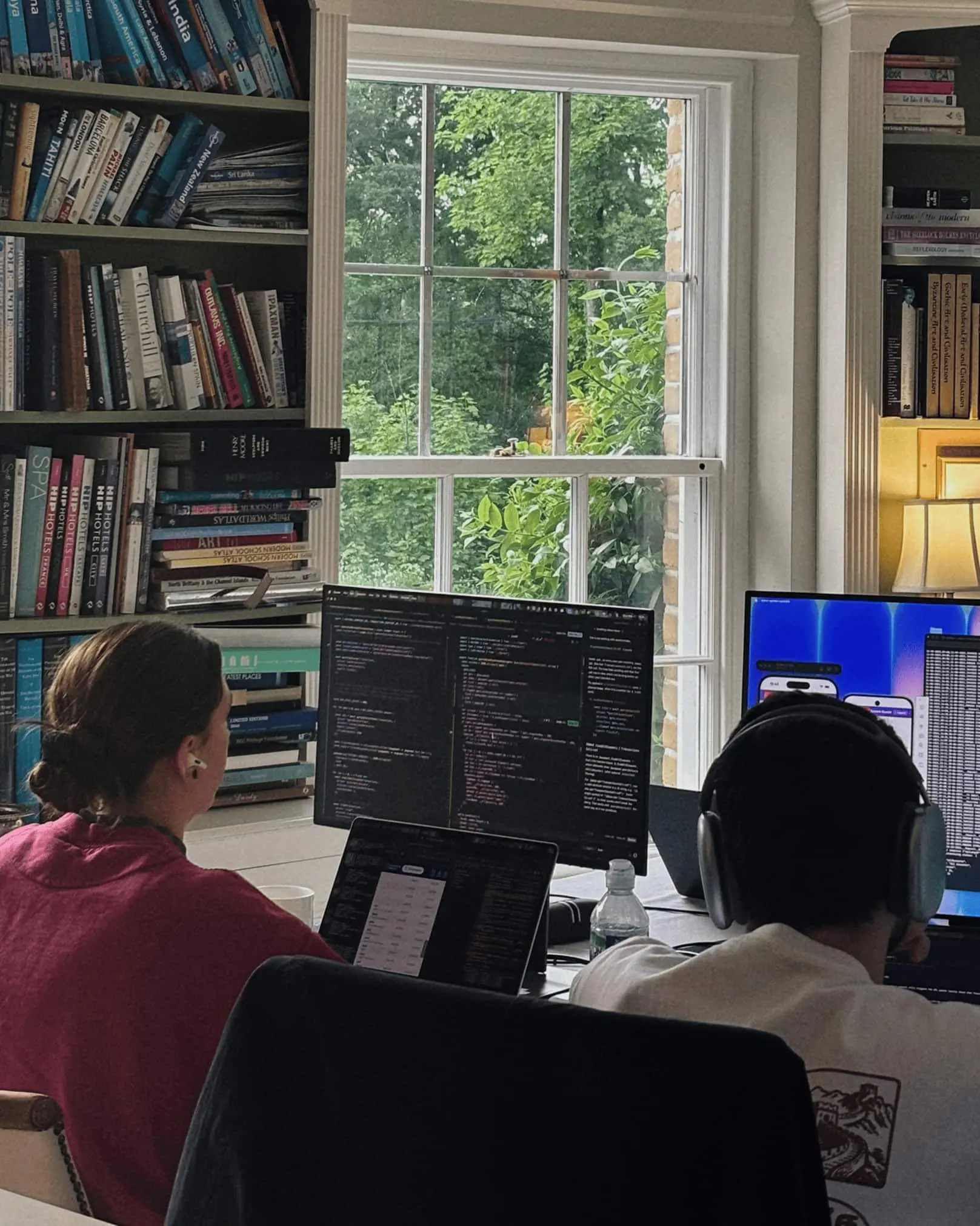 Quartz engineers working together beside a window