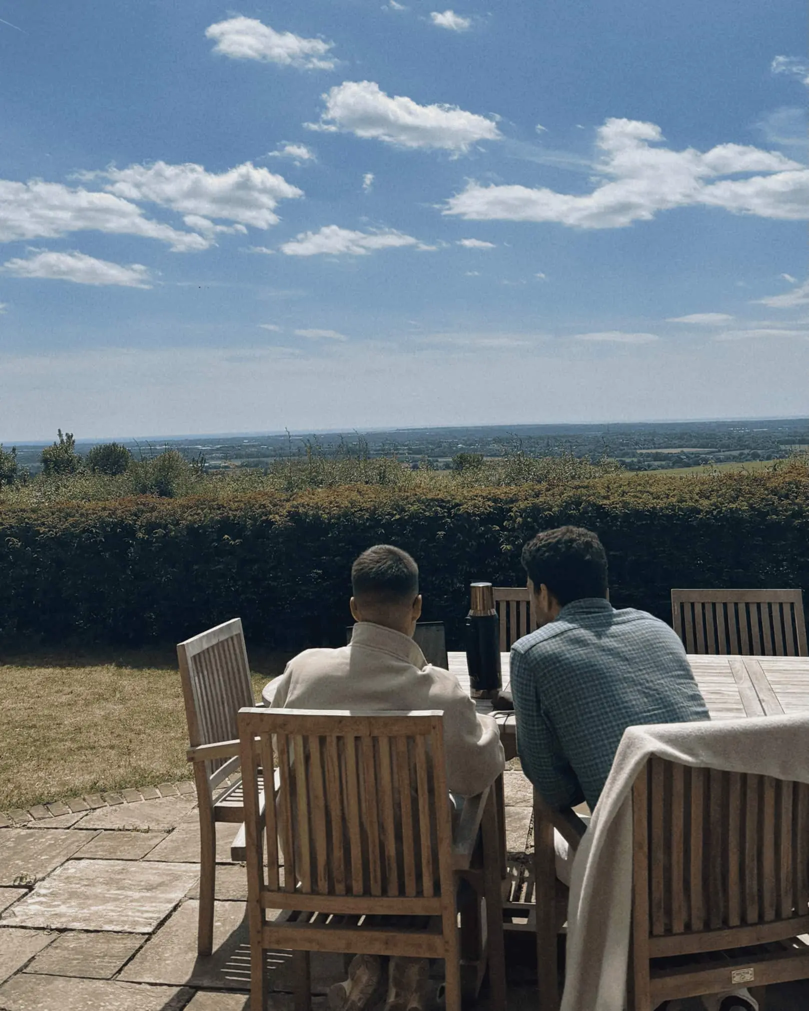 Quartz team members overlooking the countryside from a terrace